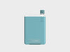 Trendy slim clear reusable waterbottle in a pale blue silicone sleeve and aqua blue lid in size A5.