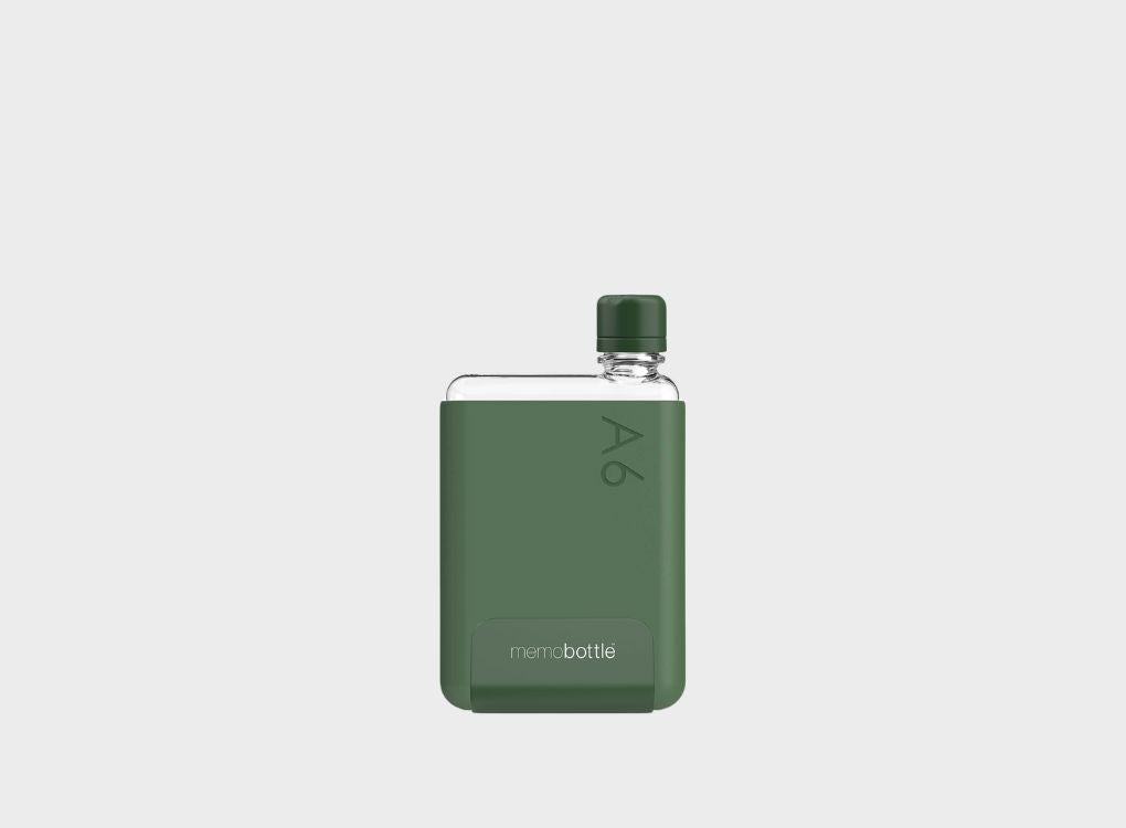 Sleek slim clear waterbottle in a dark green silicone sleeve and dark green lid in size A6.