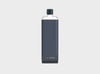 On trend clear reusable waterbottle in a navy blue silicone sleeve and navy blue lid in size slim.