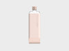 Viral reusable clear waterbottle in a neutral pink silicone sleeve and nude pink lid in size slim.