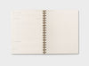 Open Daily Planer made from recycled materials with dot-grid page on one side daily planning template on the other